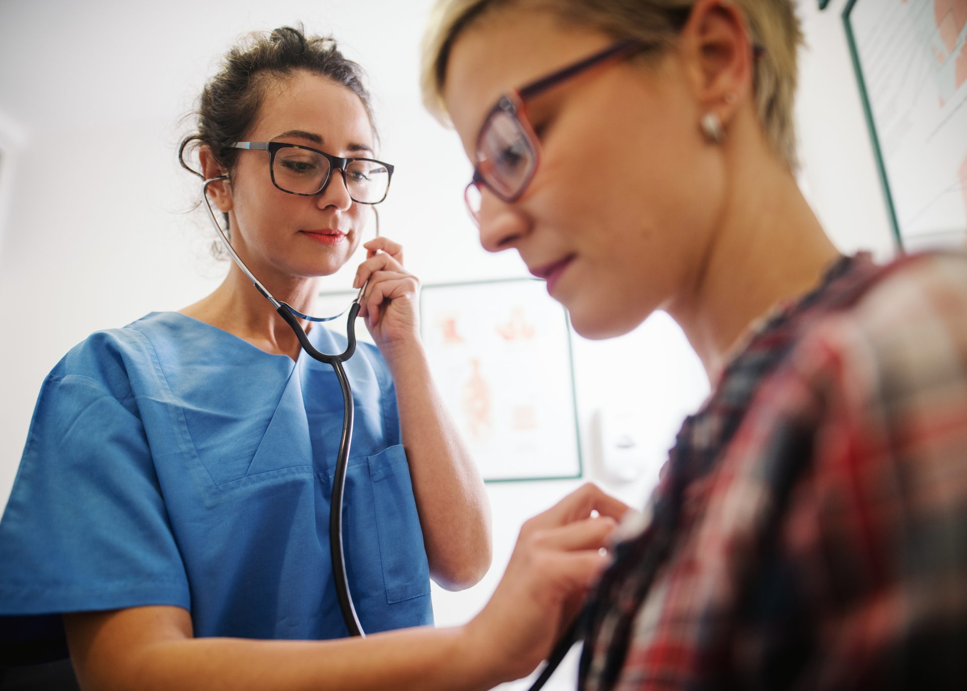 Doctor using a stethoscope
